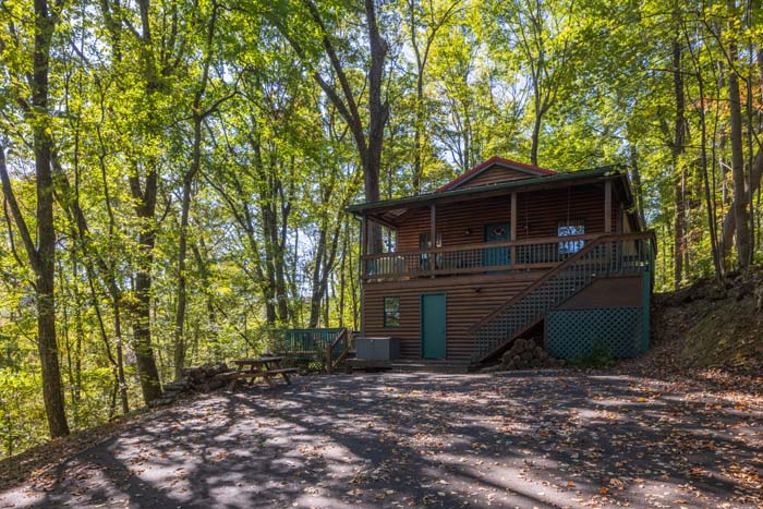 Secluded log cabin surrounded by woods