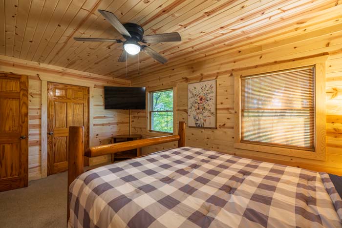 Bedroom with cozy linens and lighting