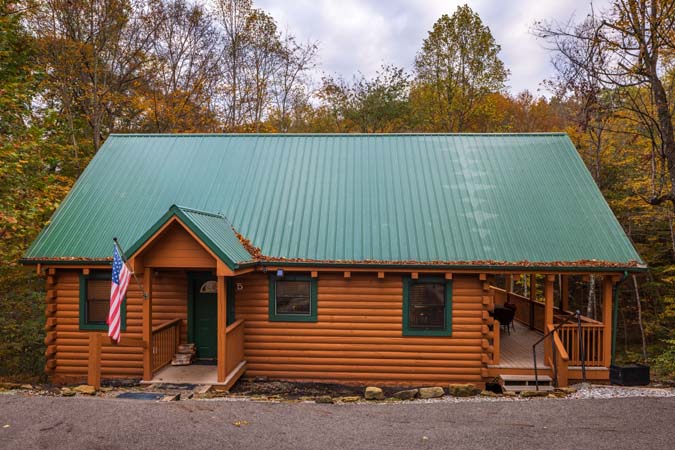 Great room with floor to ceiling fireplace at Cardinal Cabin