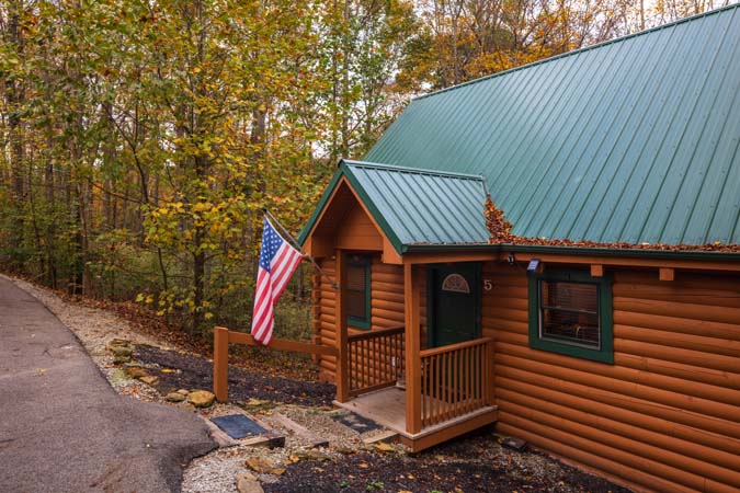Living room seating and fireplace at Cardinal Cabin