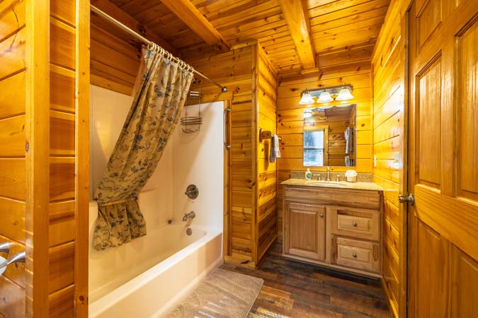 Bedroom with two queen beds at Cardinal Cabin