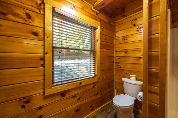 Loft sleeping area with queen beds at Cardinal Cabin