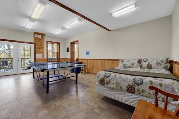 ping pong table and bed in game room