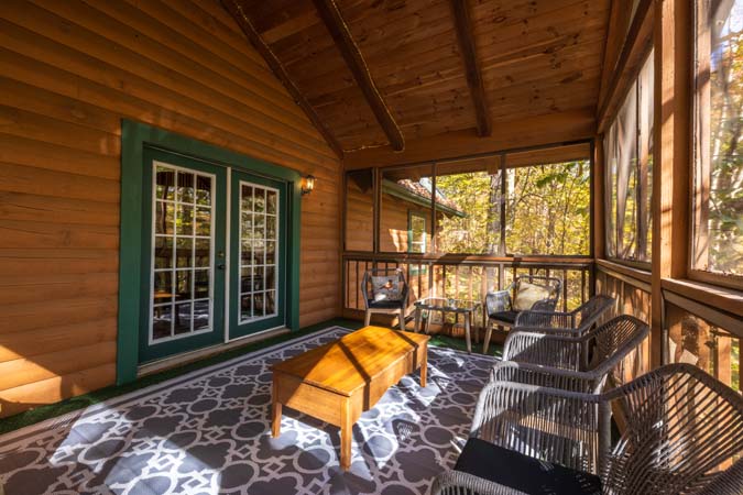 Great room with stone fireplace at Chickadee Cabin