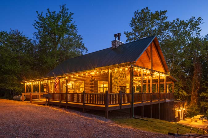Evening exterior view of Green Acres Lodge and covered porch