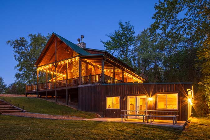 Hocking Hills lodge exterior at twilight with glowing windows