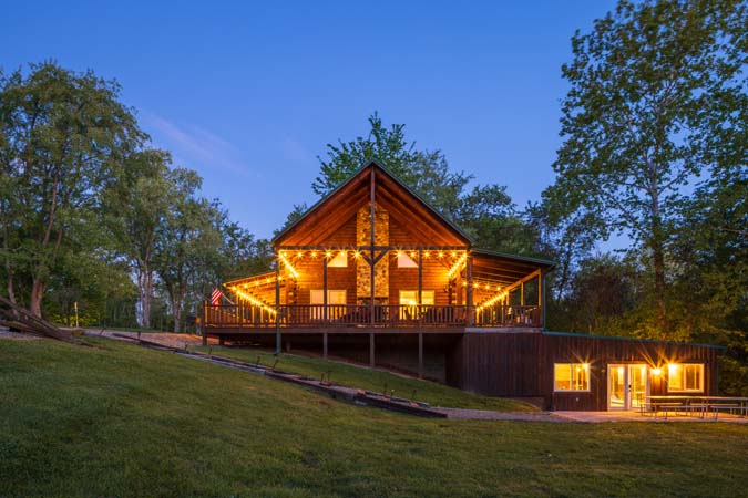 Green Acres Lodge wraparound porch during evening hours