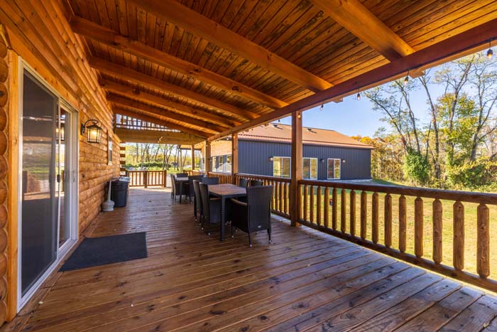 Covered deck dining area overlooking the game barn