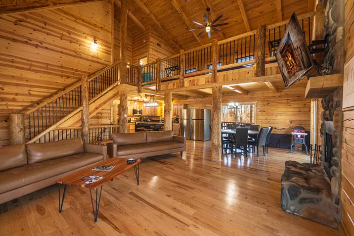 Great room and loft staircase with leather seating