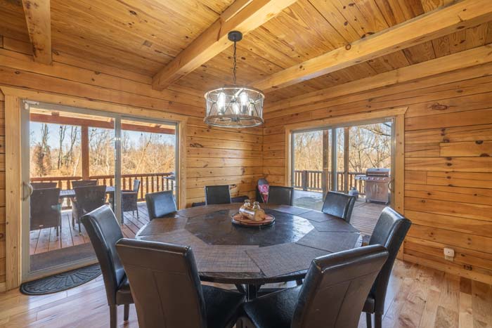 Dining room with round table for eight and chandelier