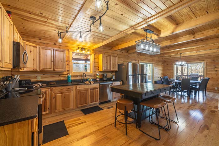 Kitchen island with stools and stainless appliances
