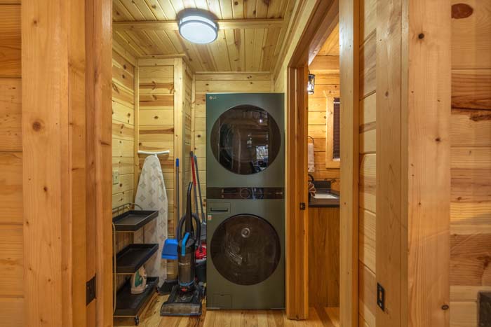 Laundry closet with stacked washer and dryer
