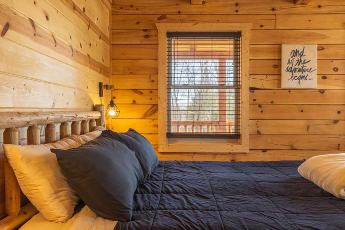 King bed with adventure-themed wall art
