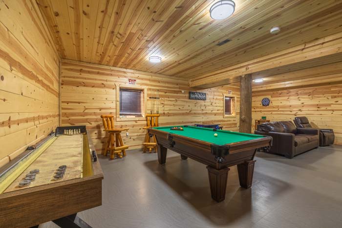Game room with pool table, shuffleboard, and dartboard
