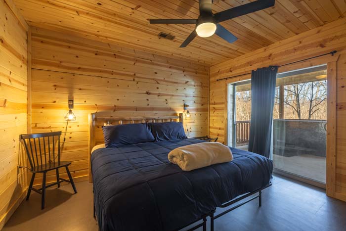 Bedroom with king bed and sliding door to the deck
