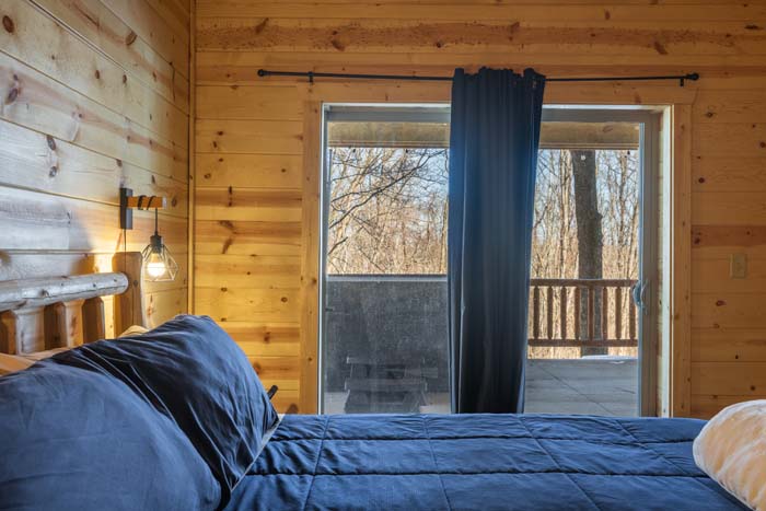 King bedroom with deck and hot tub access