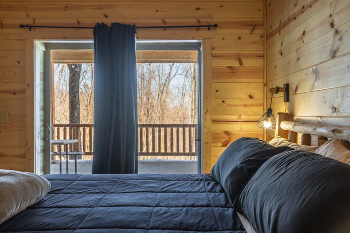 Bedroom with sliding glass door to the deck