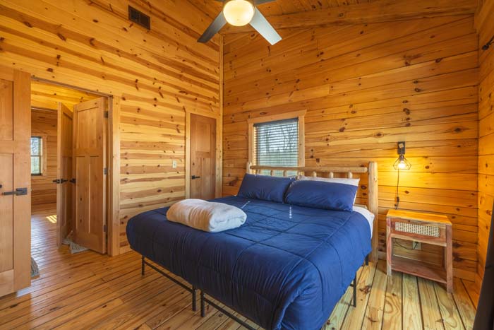 Bedroom with king bed and ceiling fan