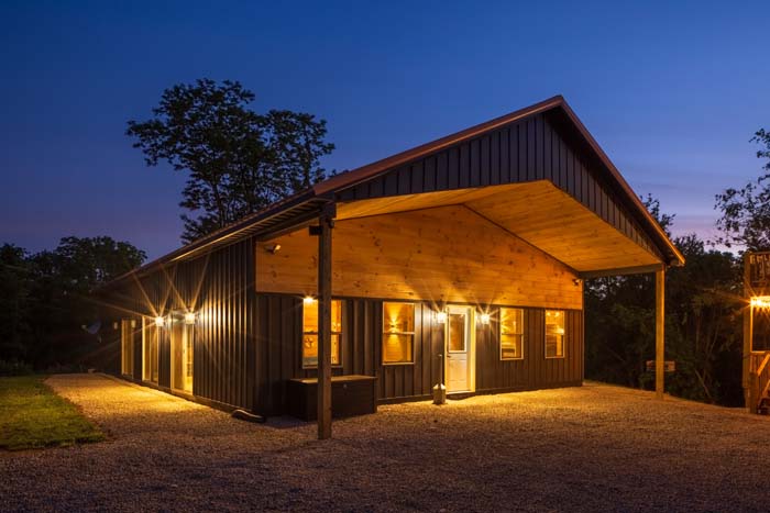Game barn lit at dusk