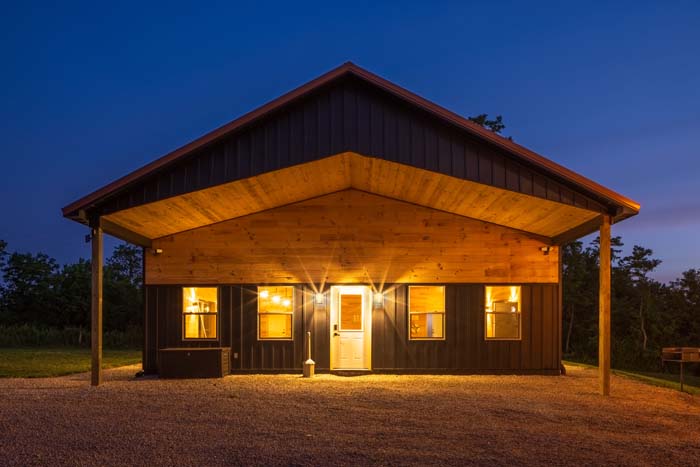 Game barn front glowing at twilight