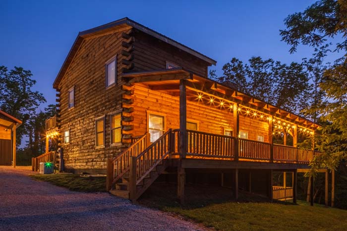 Highland Lodge lit at dusk with string lights