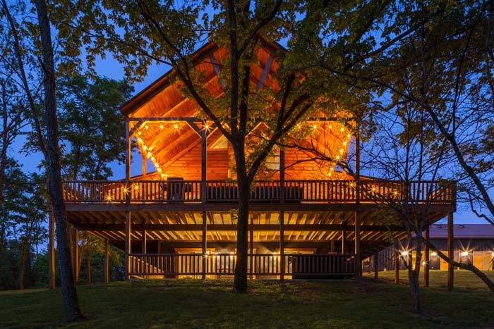Highland Lodge at dusk through the trees