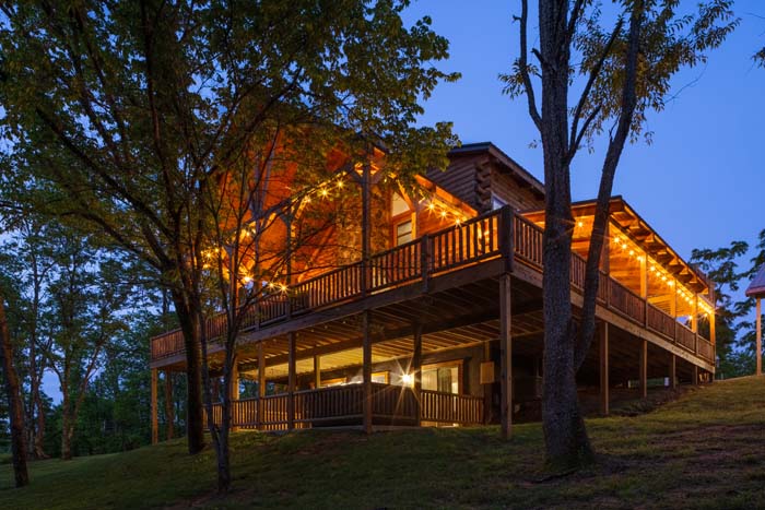 Highland Lodge side decks lit at dusk