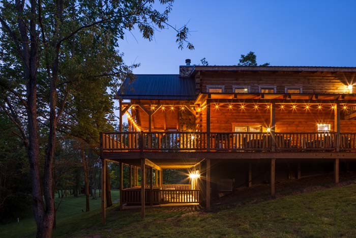 Highland Lodge rear decks lit at twilight