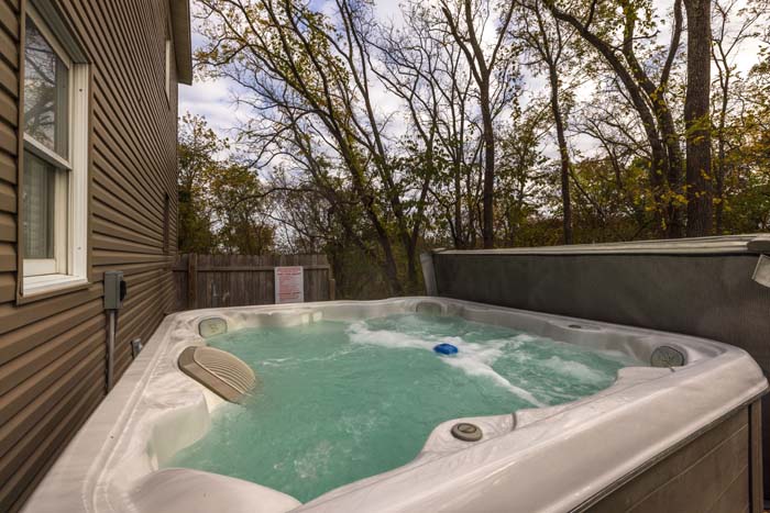 Hot tub on the patio with woodland views