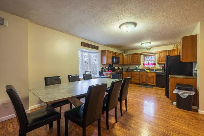 Dining area with large table beside the kitchen