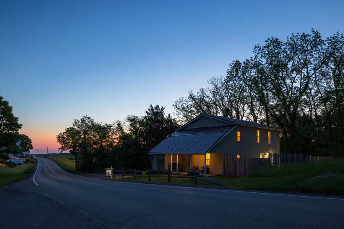 Hiker's Hideout from the road at dusk with sunset sky