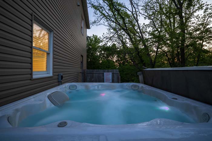 Hot tub lit at dusk at sunset