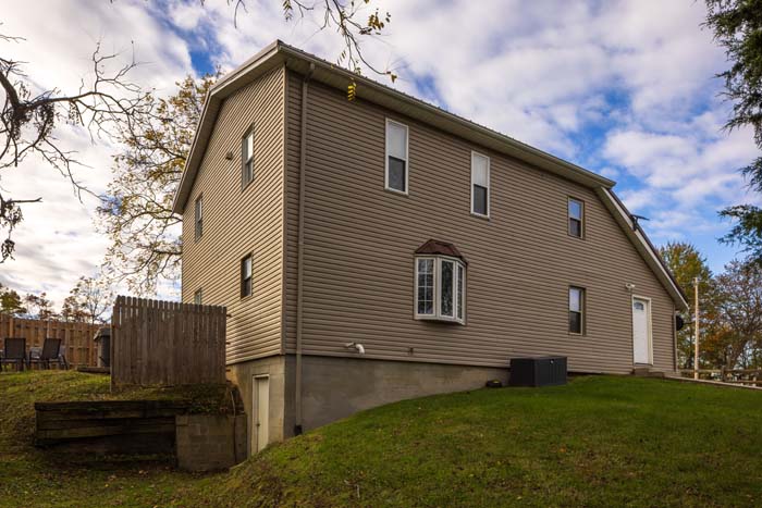 Side exterior of Hiker's Hideout with bay window