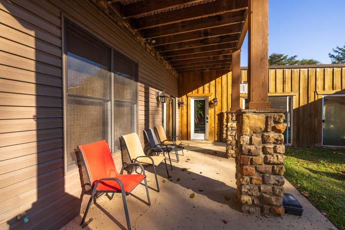 Indoor heated saltwater pool with sliding glass doors and natural light