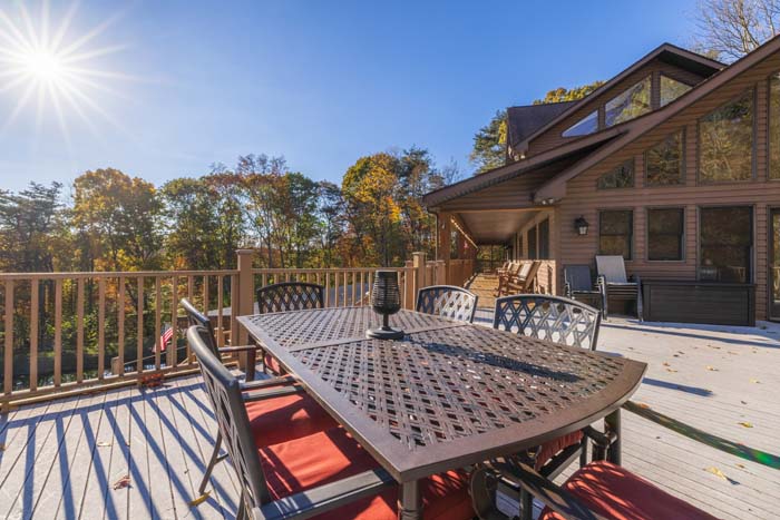 Luxury pool area with natural light and open glass doors
