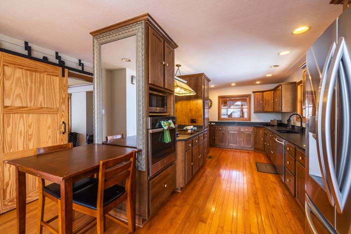 Game area with pool table and classic arcade games