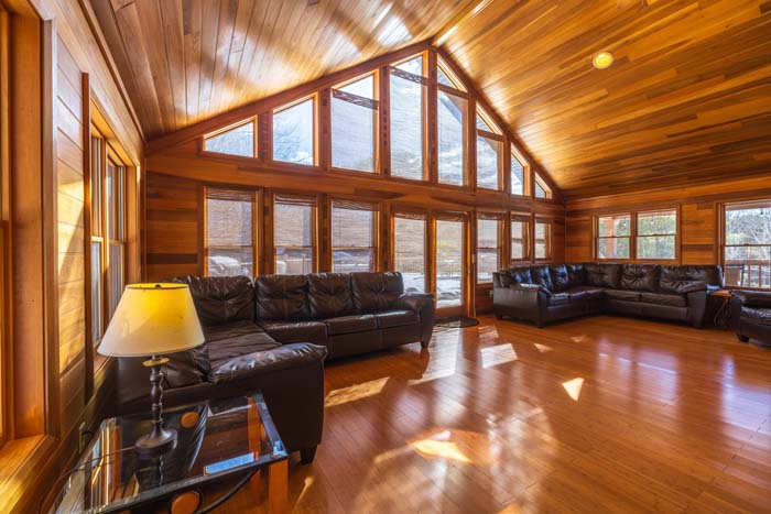 Open concept living area with spacious seating and natural light