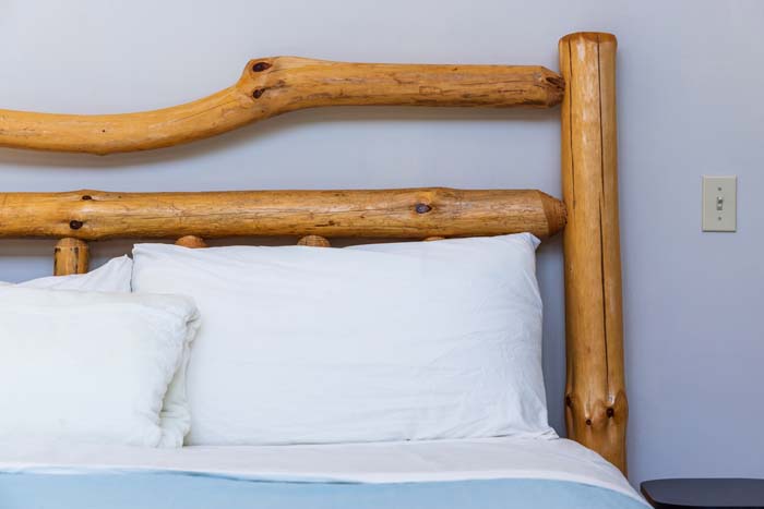 Private bedroom with comfortable bedding and natural light