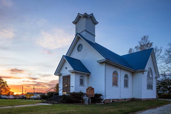 Kitchen with stainless steel appliances and farmhouse dining area