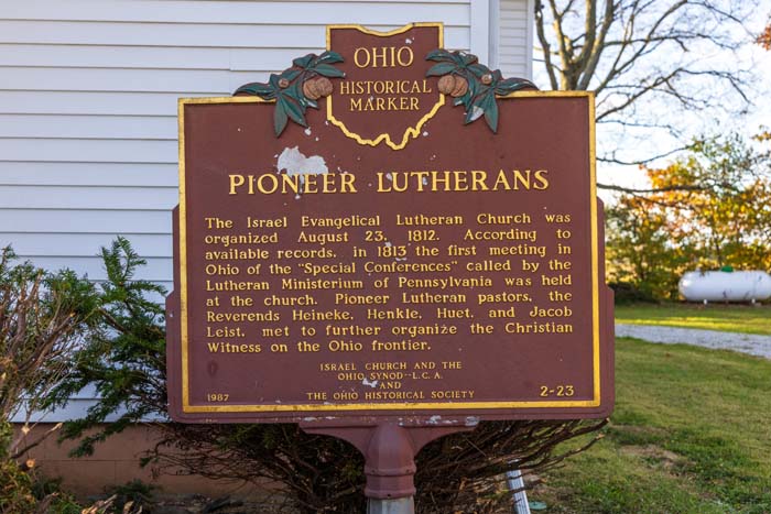 Outdoor picnic table and charcoal grill setup