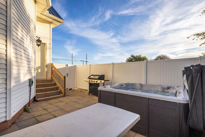 Private hot tub near wooded edge at Dragonfly Inn