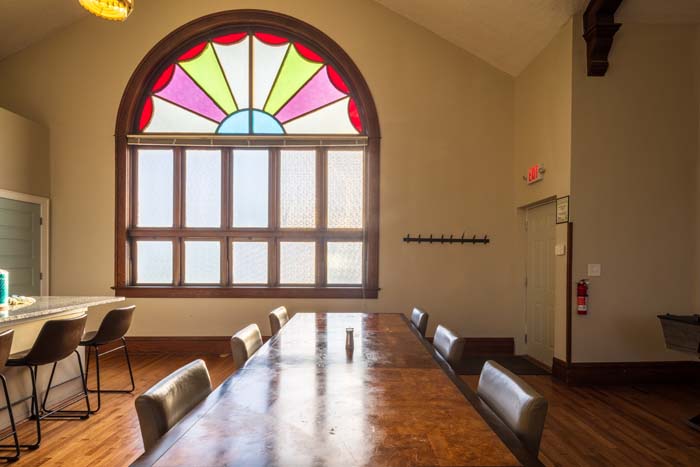 Back view of Dragonfly Inn with outdoor seating area