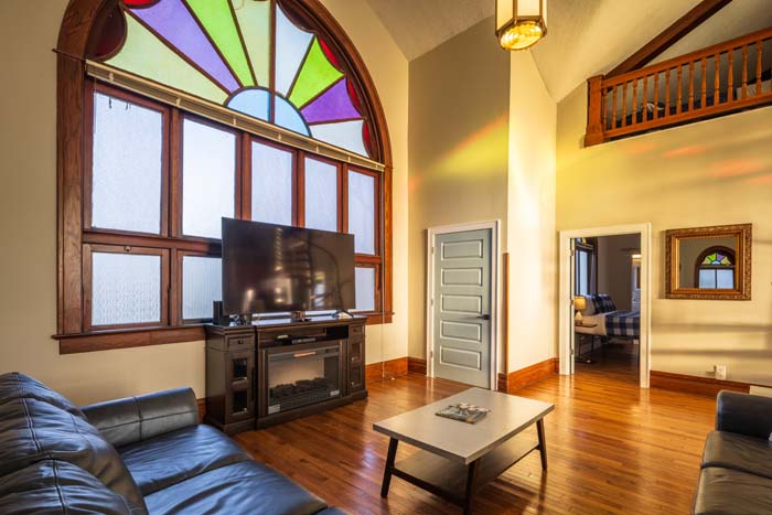 Dining area with farmhouse table and pendant lighting