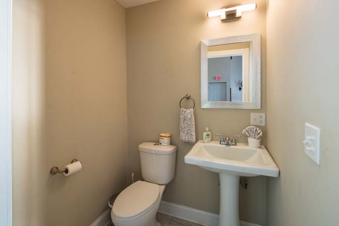 Guest bedroom with neutral decor and cozy bedding