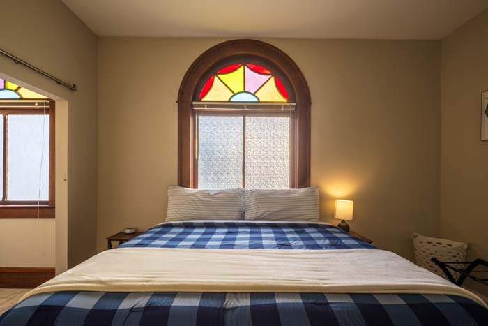 Restored church window letting natural light into main area