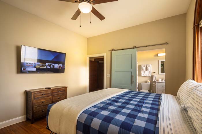 View of loft beds and railing overlooking main floor