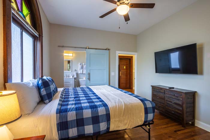 Historic cross detail preserved on building façade