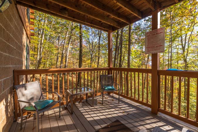 Stone fireplace detail in great room at Mockingbird Cabin