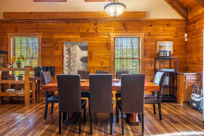 Loft sleeping area with two queen beds at Mockingbird Cabin