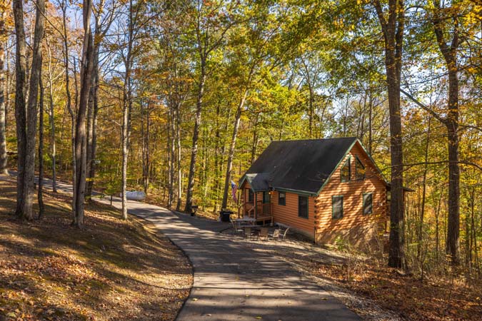 Covered deck with valley views at Mockingbird Cabin
